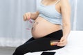 Close up of pregnant shopping baby products for children Royalty Free Stock Photo