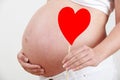Close Up Of Pregnant Woman Holding Heart Shape On Stick Royalty Free Stock Photo