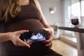 Close Up Of Pregnant Woman Holding Mobile Phone With Ultrasound Scan Of Baby Royalty Free Stock Photo