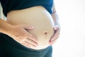 Close up pregnant woman`s belly. prenancy and maternity concept. Royalty Free Stock Photo