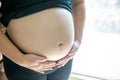 Close up pregnant woman`s belly. prenancy and maternity concept. Royalty Free Stock Photo