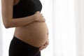 Close up of pregnant woman touch baby bump Royalty Free Stock Photo