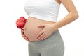 Close up of pregnant woman touching her bare tummy Royalty Free Stock Photo