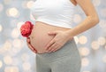 Close up of pregnant woman touching her bare tummy Royalty Free Stock Photo