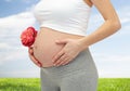 Close up of pregnant woman touching her bare tummy Royalty Free Stock Photo