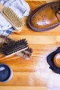 Close-up of Premium Tan Brogue Leather Boot with Set of Cleaning Tools