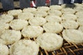 Closeup of sticky rice cakes drying on a bamboo rack in Luang Prabang, Laos Royalty Free Stock Photo