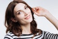 Close up of pretty auburn-haired woman posing