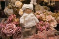 Close up of pretty doll on the roses at the interior of traditional christmas market in Sant`Elpidio a Mare