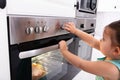 Girl Adjusting Temperature Of Microwave Oven