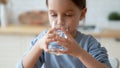 Close up pretty little girl enjoying pure mineral water Royalty Free Stock Photo