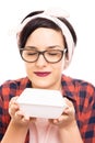Close-up pretty pin-up girl wearing glasses smelling to go lunch Royalty Free Stock Photo