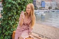 Close up of pretty tourist girl eating traditional gelato italian ice cream in a European town Royalty Free Stock Photo