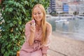 Close up of pretty tourist girl eating traditional gelato italian ice cream in a European town Royalty Free Stock Photo