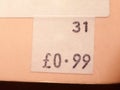 Close up of price tag on back of book charity shop 0.99 99p Royalty Free Stock Photo
