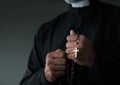 Close up of a priest holding rosary Royalty Free Stock Photo