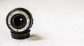 Close up of a prime camera lens against white background. Selective focus Royalty Free Stock Photo