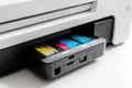 A close-up of a printer with four removable ink cartridges Royalty Free Stock Photo