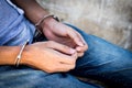 Close up prisoner hands in handcuffs. Arrested man in handcuffed hands Royalty Free Stock Photo