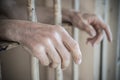 Close up of prisoner hands in a jail