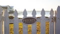 Close up - Private No Trespassing sign picket fence