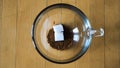 Close-up of process of brewing instant coffee in cup. Concept. Top view of stages of adding ingredients for instant
