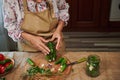 Close-up canning gherkins. Preserving organic cucumbers with umbrella dill, fresh garlic and fragrant culinary herbs.