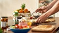 Close up of process of cooking. Man preparing meal while woman checking recipe using tablet. Vegetarians cooking in the Royalty Free Stock Photo