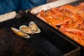 Close up - process of cooking mussels, clams on grill - seafood concept Royalty Free Stock Photo