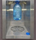 Close-up, the process of filling a bottle of clean drinking water from a water purification machine Royalty Free Stock Photo