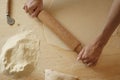 Close up detail of process of homemade vegan farfalle pasta with durum wheat flour. The cook kneads the dough on the wooden Royalty Free Stock Photo