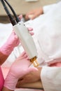 Process of laser hair removal on the arm in clinic, close-up