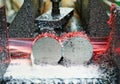 Close-up process of metal machining by saw