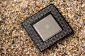 Close-up of a processor with sand in the background