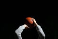Close up of professional basketball player throwing a ball at night. Street basketball athlete training for competition in the Royalty Free Stock Photo