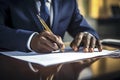 Close-up of a professional businessman's hands signing a legal document or contract Royalty Free Stock Photo