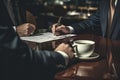 Close-up of a professional businessman's hands signing a legal document or contract Royalty Free Stock Photo