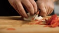 Close-up of professional chef slicing onions. Stock footage. Slicing onions for dish with sharp knife in hands of Royalty Free Stock Photo