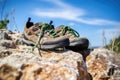 close-up of professional climbing shoes on a rocky cliff