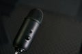 Close-up of professional condenser microphone on a black background Royalty Free Stock Photo