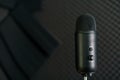 Close-up of professional condenser microphone on a black background Royalty Free Stock Photo