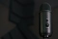 Close-up of professional condenser microphone on a black background Royalty Free Stock Photo