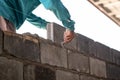 Close-up of professional construction worker laying bricks. Royalty Free Stock Photo