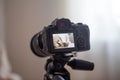 Close up of professional digital camera on tripod Royalty Free Stock Photo