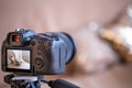 Close up a professional digital camera on a tripod while shooting a home composition Royalty Free Stock Photo