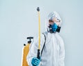 professional disinfector performs the treatment with an antibacterial spray.