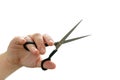 Close up of professional hairdresser holding scissors on white background. Barber work tool - scissors on bright backdrop