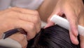 Close-up professional hairdresser using scissors and clippers and accessories for beautiful and decorating men hair Cutting hair