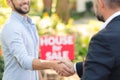 House seller shaking buyer`s hand Royalty Free Stock Photo