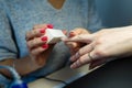 Close-up professional manicure pedicure polishing nail file client. Royalty Free Stock Photo